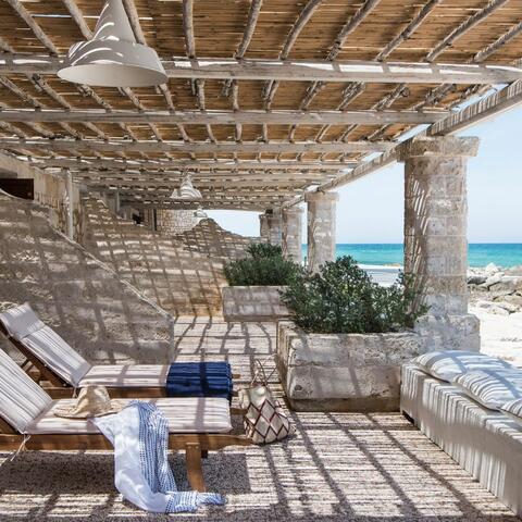 The private patios at La Peschiera, which look out over the sea