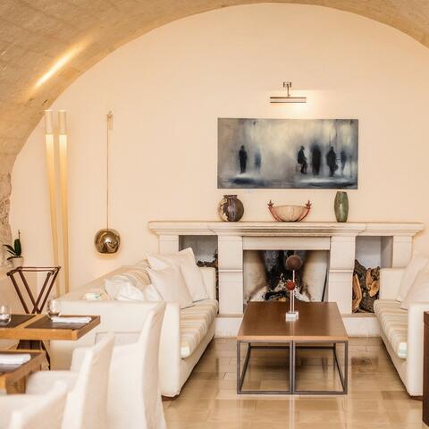 Cream sofas under a vaulted ceiling at Sommita