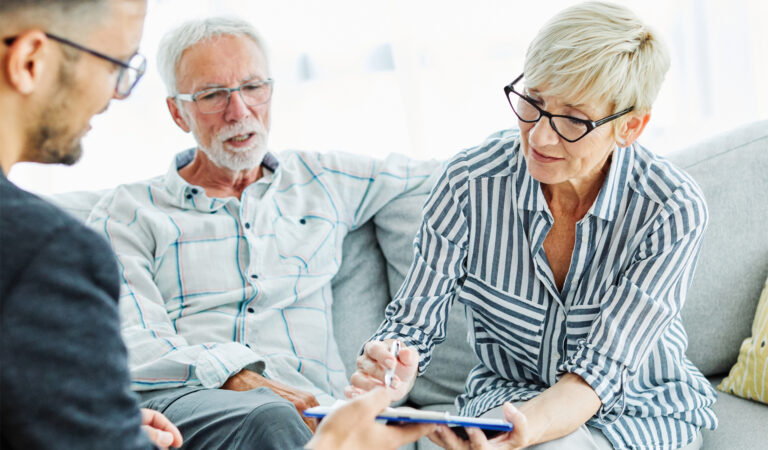 A person signing a rental or homeowners insurance document.