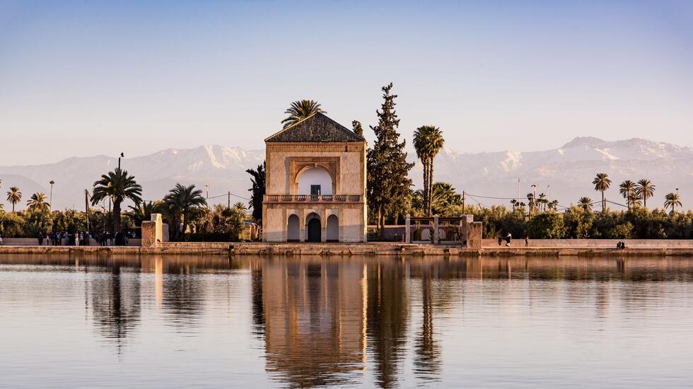 The atlas mountains reflected in a pool at Menara Gardens