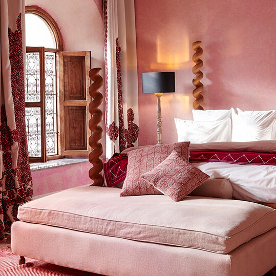 A pink bedroom at El Fenn