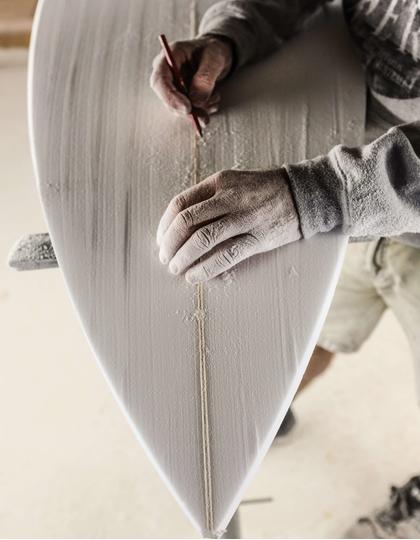 Di Sciascio at work making a surf board