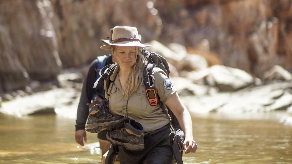 Woman walking through lake in Australia