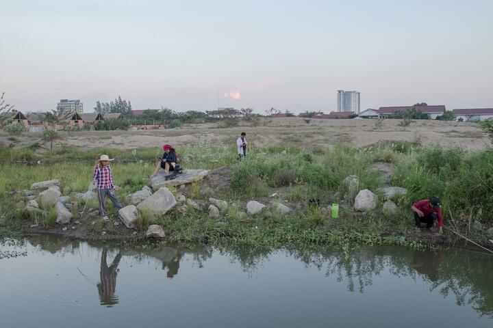 On the outskirts of the city, a group of friends meet to fish on the banks of a waterway.