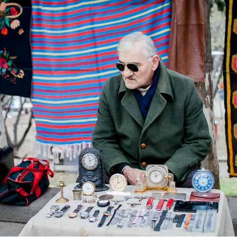 A stall holder at Dry Bridge Flea Market in Tbilisi, Georgia