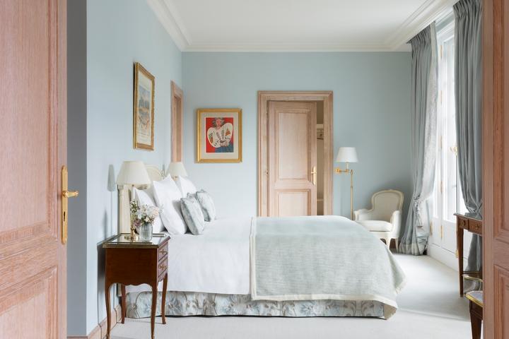 A baby blue bedroom at Hotel Le Bristol in Paris