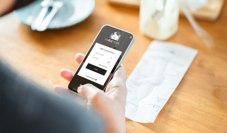 A person submitting a receipt using the MyALE HOME App for faster reimbursement.