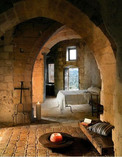 A softly-lit bedroom in a cave dwelling