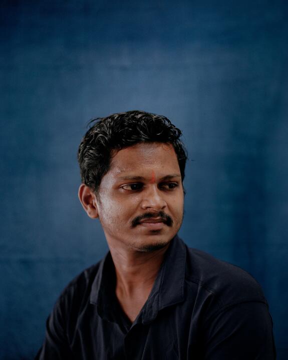 A staff member at The Colours of Nature, Tamil Nadu, India