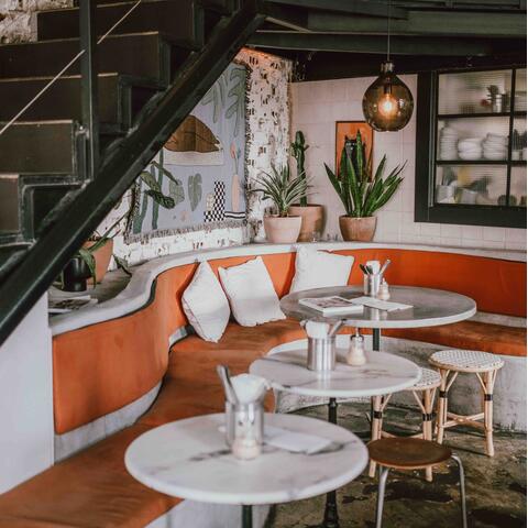 Groovy orange and green interiors at Cafe Janis, Lisbon