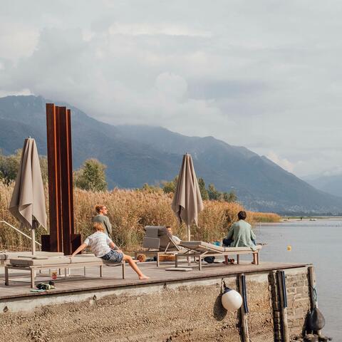 People by the lake at Castello del Sole, Ticino