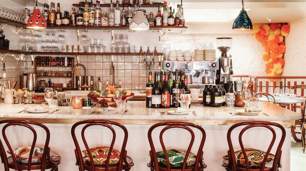 The colourful, busy bar counter at Jikoni, Mayfair