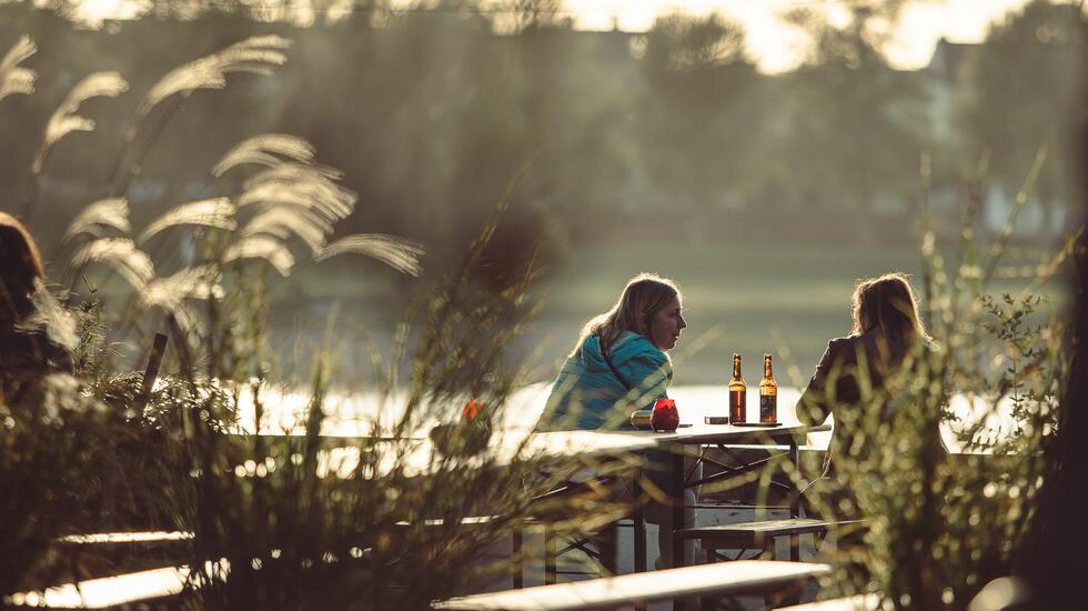 Two woman drinking beers