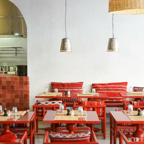 The red and white interiors of Le Kilim's dining room