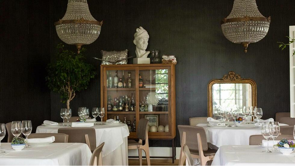 The black-walled dining room