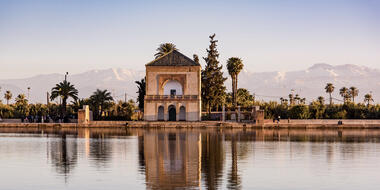 The atlas mountains reflected in a pool at Menara Gardens