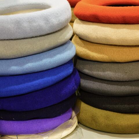 Colourful berets stacked up